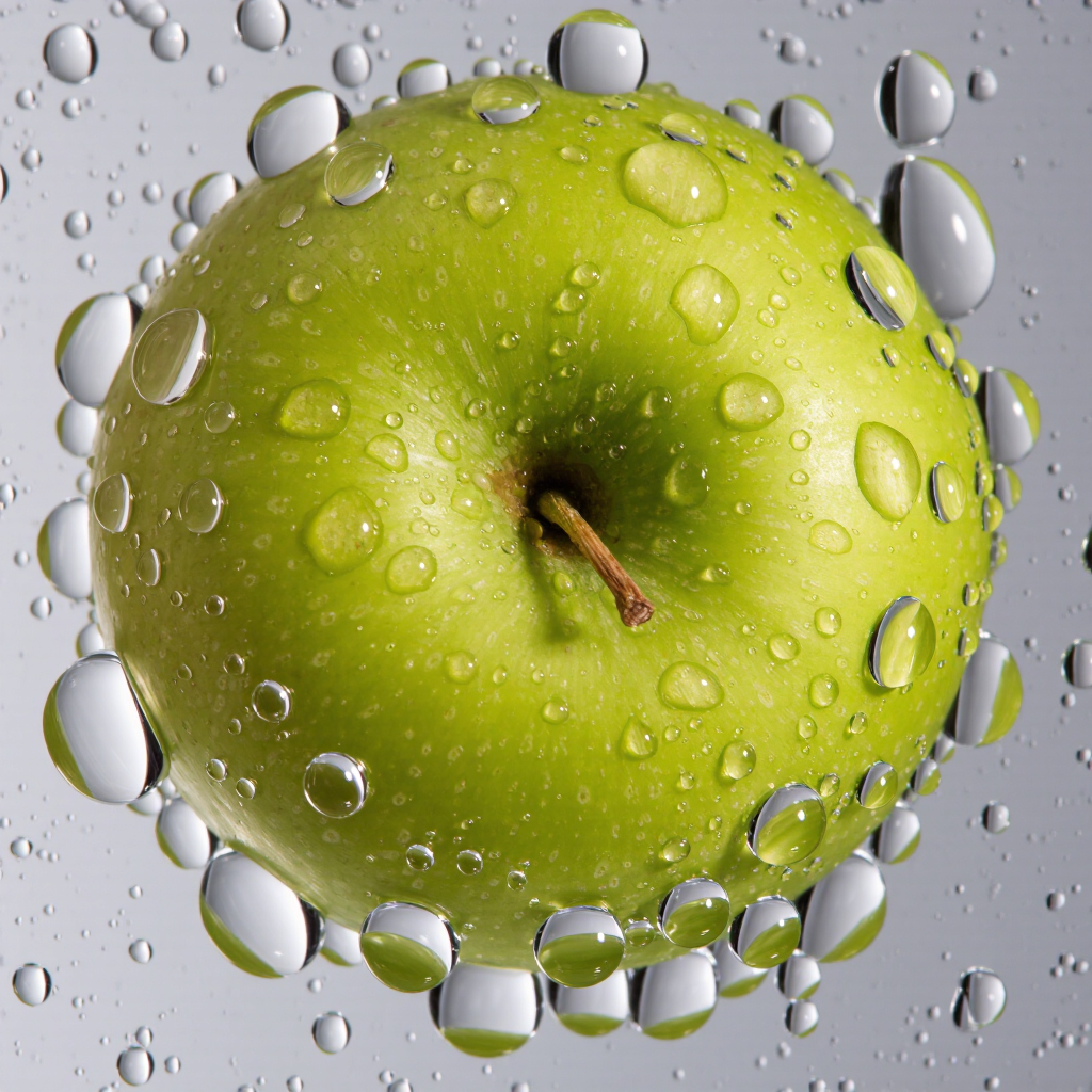 Realistic macro photograph of water droplets on a fresh green apple, studio light, crisp reflections, ultra-detailed.